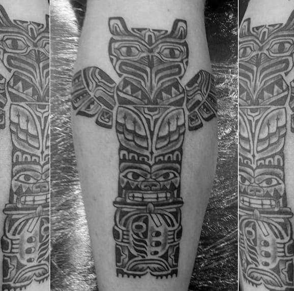 Man With Shaded Totem Pole Calf Tattoo