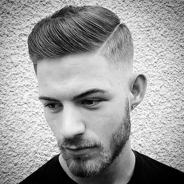 Man With Short Comb Over Skin Fade Haircut