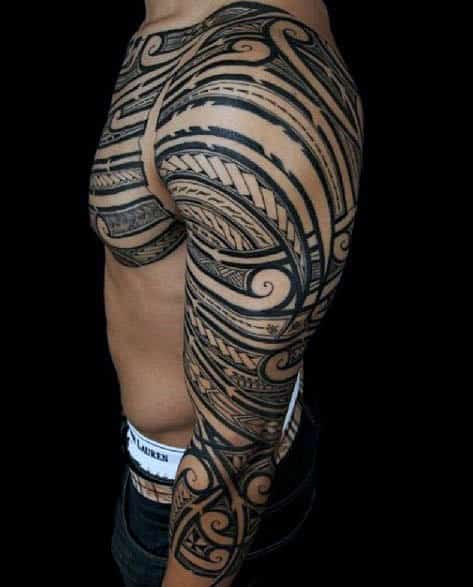 Man With Shoulder And Half Sleeve Tribal Tattoo Design