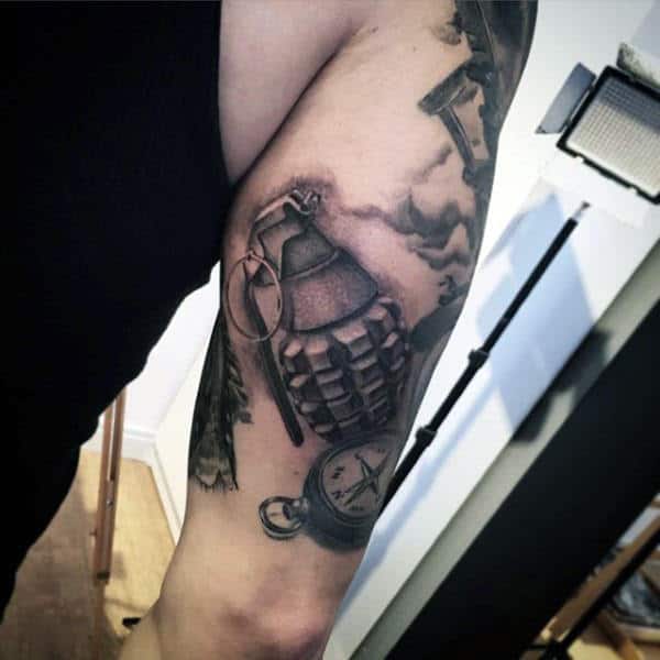 Man With Sick Grenade Tattoos On Forearms