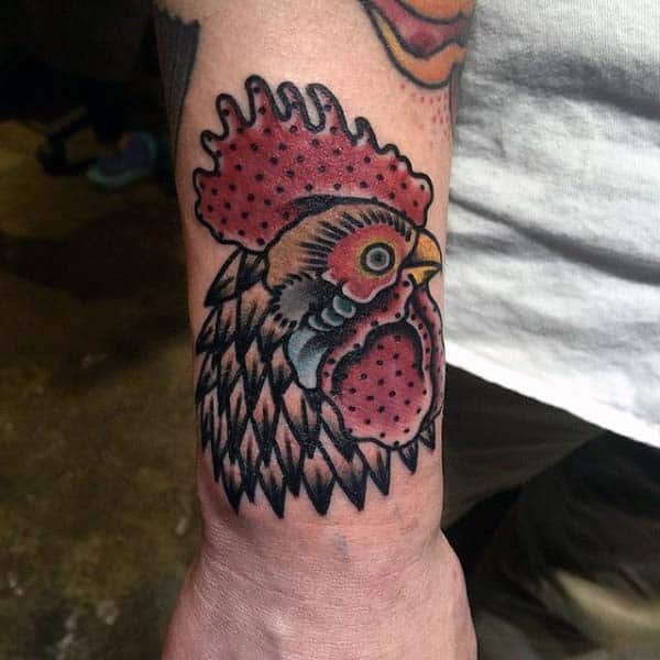 Man With Simple Rooster Tattoo On Wrist In Neo Traditional Style