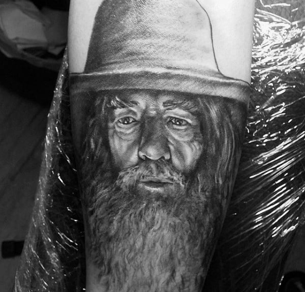 Man With Sketched Gandalf Lord Of The Rings Tattoo On Arm