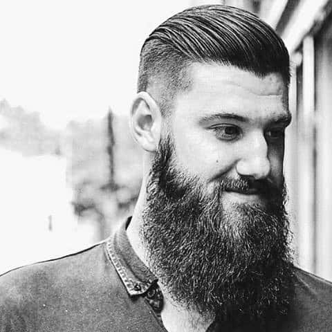 Man With Slicked Back Hair Undercut And Beard
