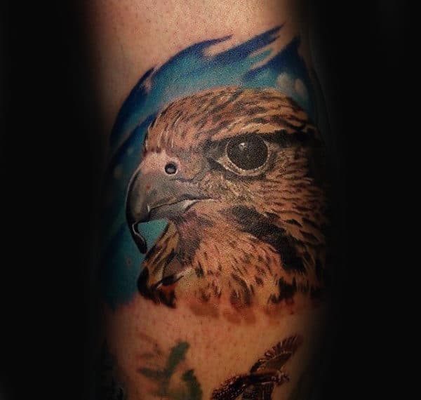 Man With Small Falcon Realistic Tattoo