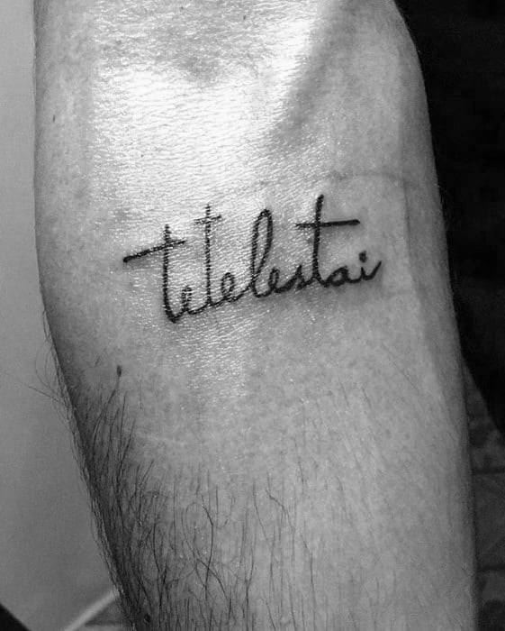 Man With Small Simple Tetelestai Tattoo On Inner Forearm