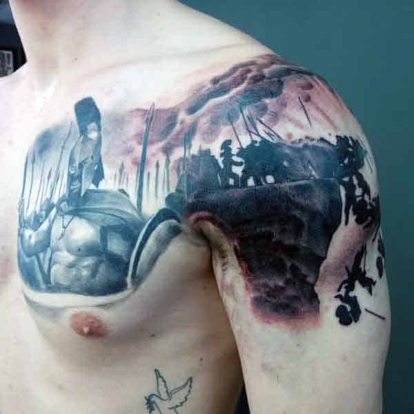 Man With Spartan Tattoo On Shoulder
