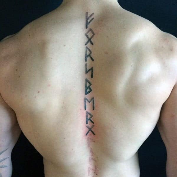 Man With Spine Rune Tattoo