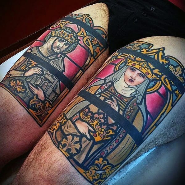 Man With Stained Glass Tattoos On Both Thighs Of Legs