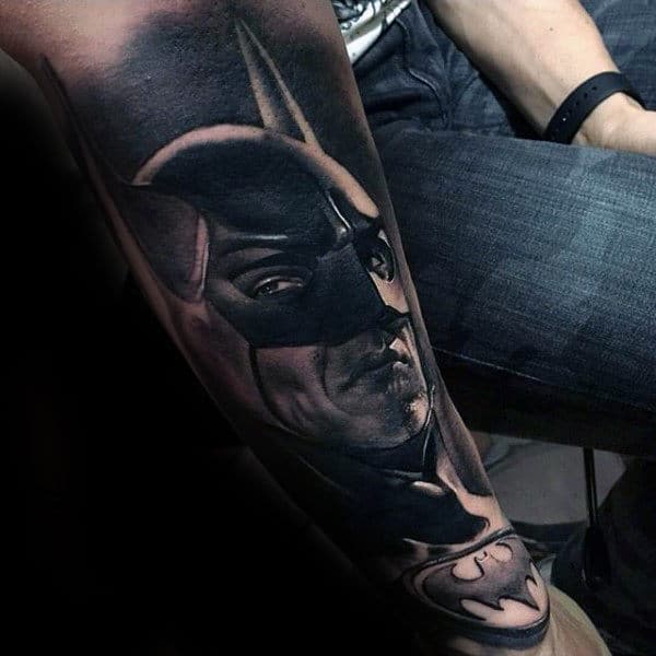 Man With Tattoo Of Batman In Black Ink On Forearm