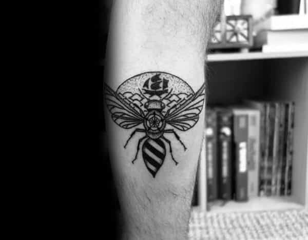 Man With Tattoo Of Bee On Leg