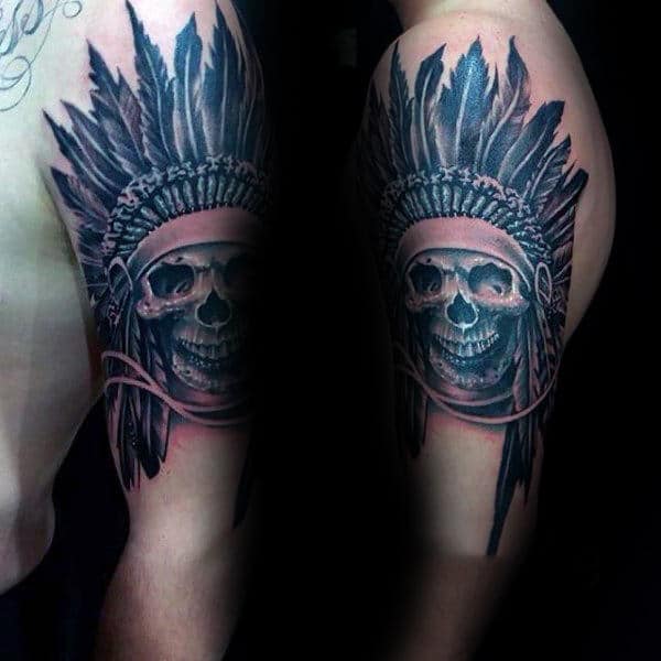 Man With Tattoo Of Indian Skull On Upper Arm
