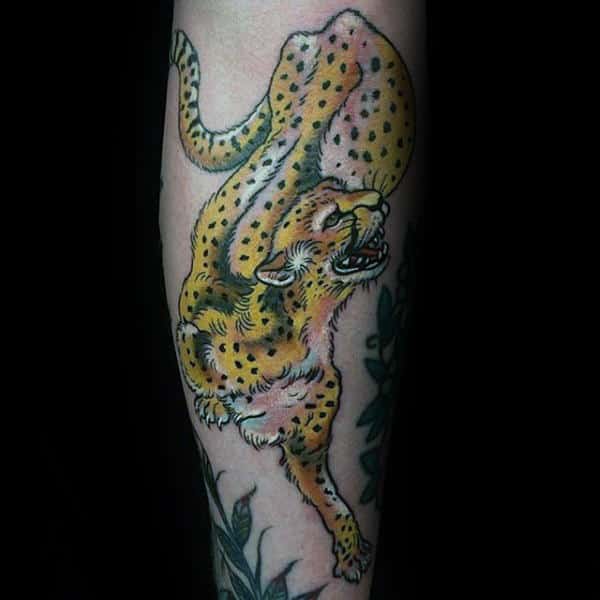 Man With Tattoo Of Leopard On Inner Forearm