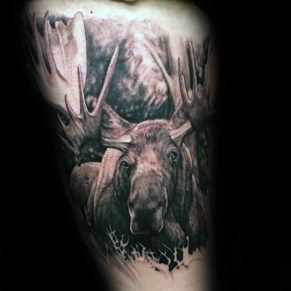 Man With Tattoo Of Moose On Thigh Of Leg