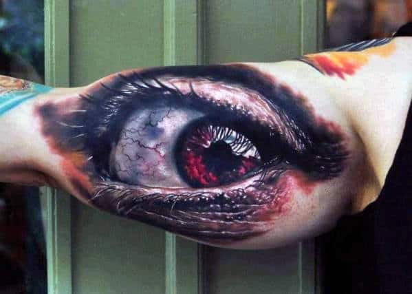 Man With Tattoo Of Realistic Optical Illusion Eye On Bicep