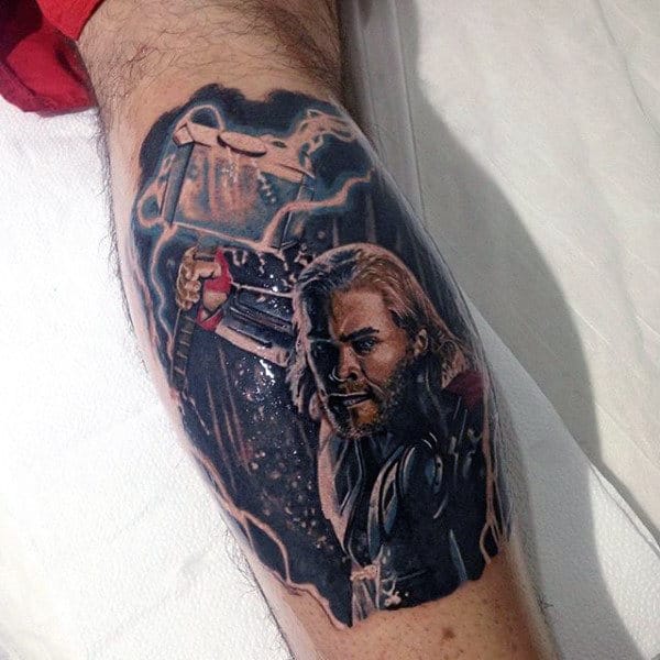 Man With Tattoo Of Thor And Mjolnir On Leg Calf