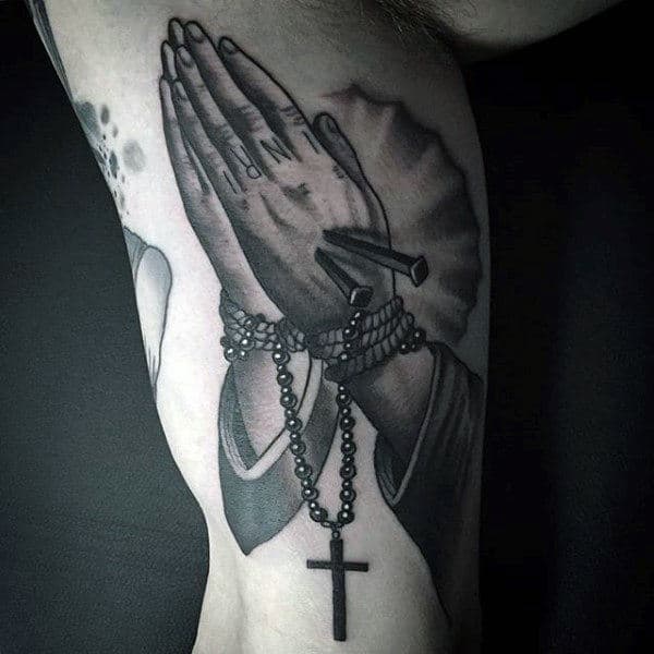 Man With Tattoo Rosaries On Bicep