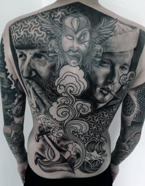 Man With Tattoos Of Sailors On Back