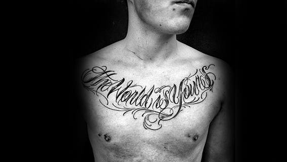 Man With The World Is Yours Script Decorative Upper Chest Tattoo Design