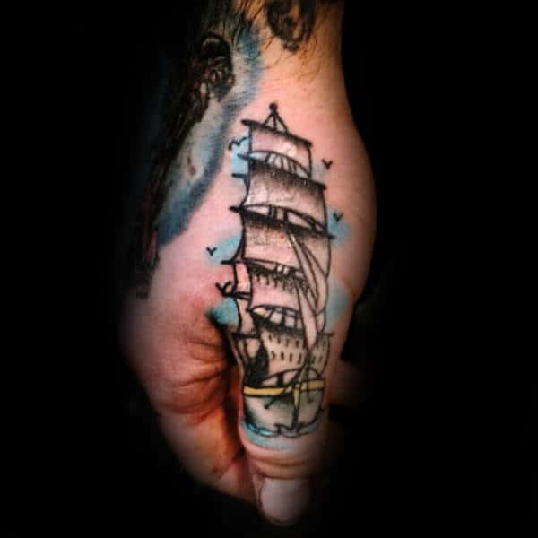 Man With Thumb Tattoo Of Sailing Ship At Sea