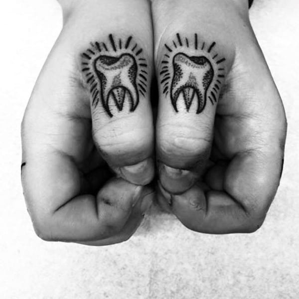 Man With Thumb Tooth Tattoos