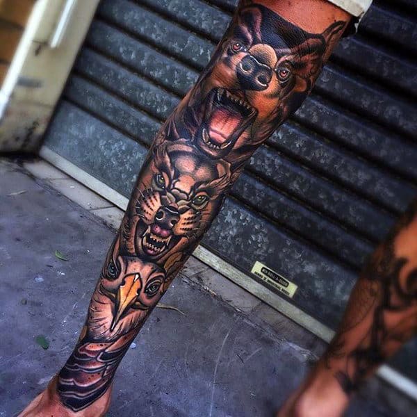 Man With Totem Pole Animals Shin Tattoo Sleeve