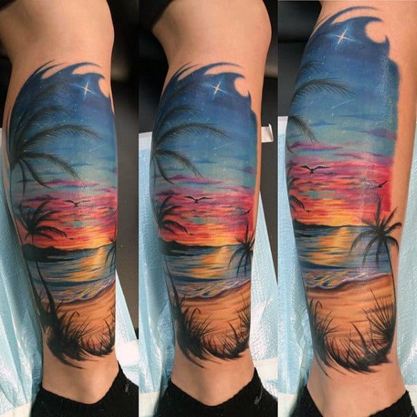 Man With Traditional Beach And Sunset Tattoo On Calf