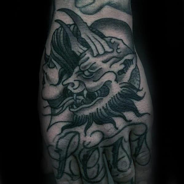 Man With Traditional Devil Hand Tattoo