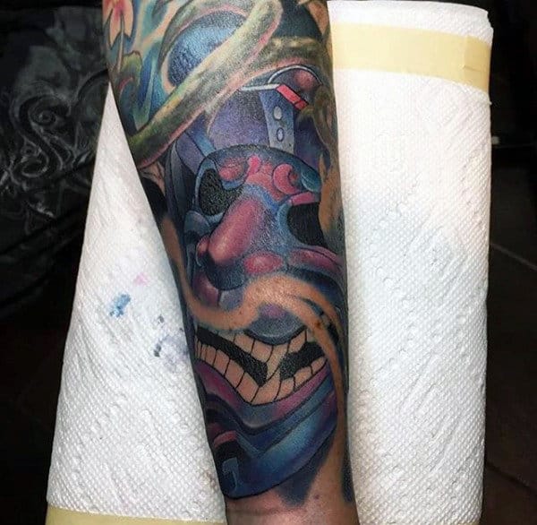 Man With Traditional Laughing Samurai Mask Half Sleeve Tattoo