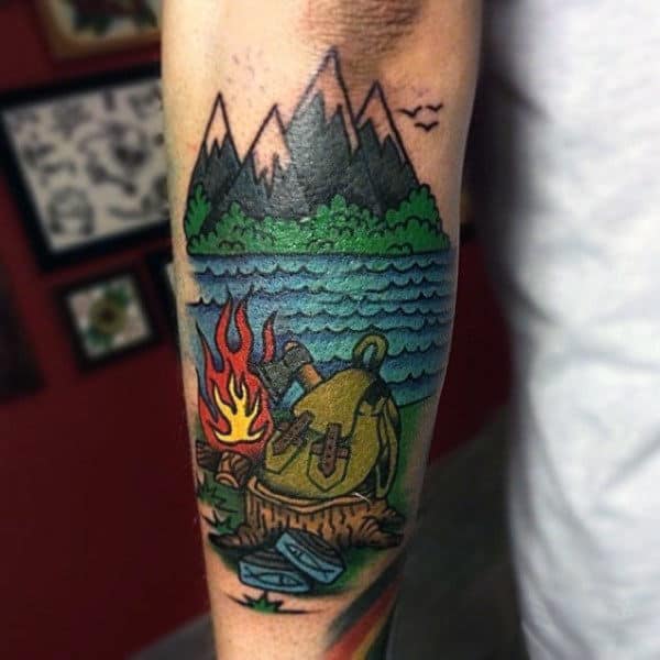 Man With Travel Camping Themed Forearm Tattoo