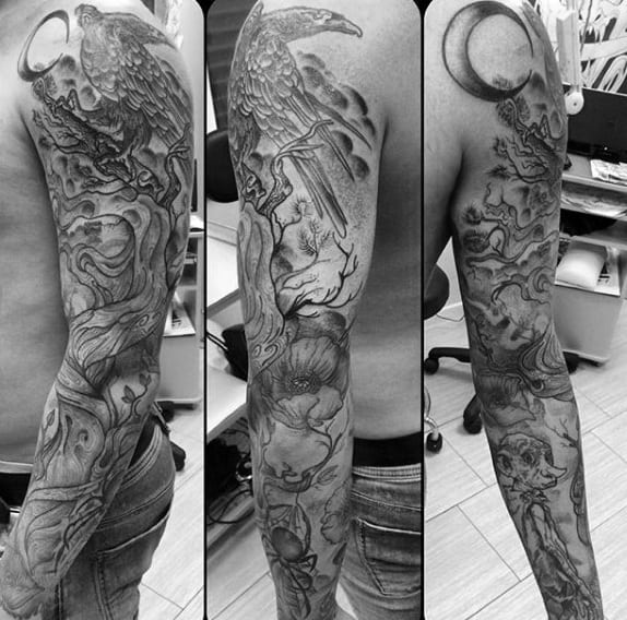 Man With Tree Sleeve Tattoo In Black And Grey Shaded Ink