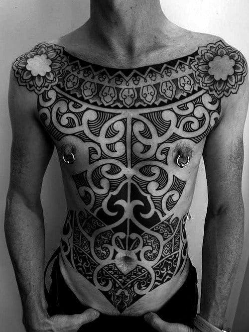 Man With Tribal Chest Arm Tattoo