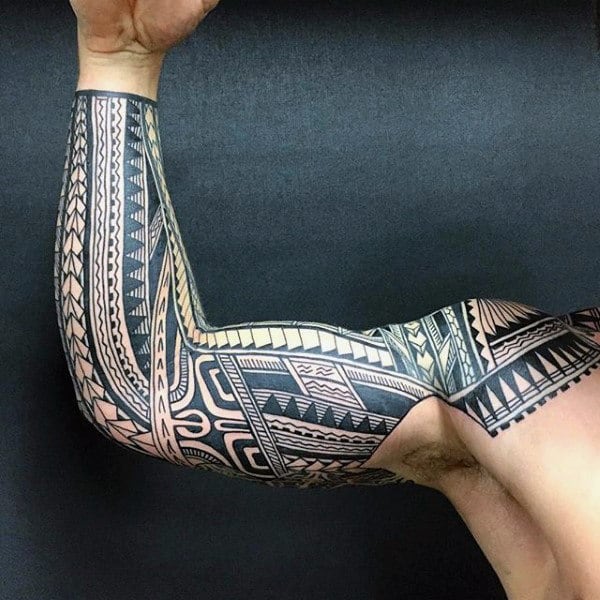 Man With Tribal Sleeve Tattoo