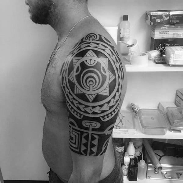 Man With Tribal Tattoo On Arm Half Sleeve
