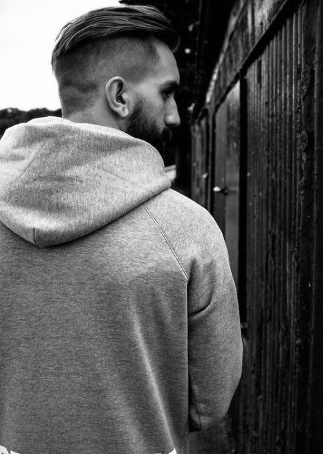 Man With Undercut And Slicked Back Haircut