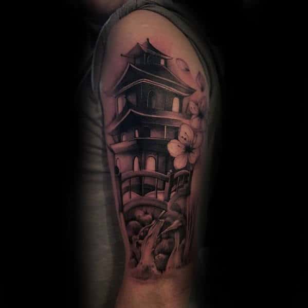 Man With Upper Arm Bridge Japanese Temple Tattoo