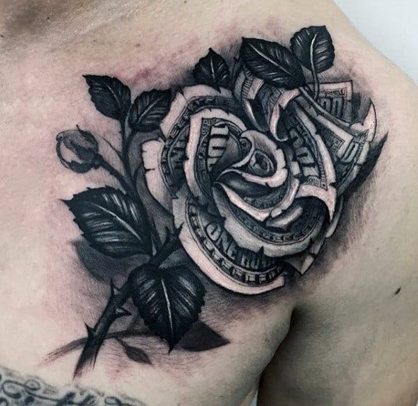 Tattoo of a rose with petals made from dollar bills on a man's shoulder
