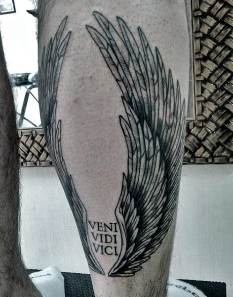 Man With Veni Vidi Vici Angel Wings Leg Tattoo