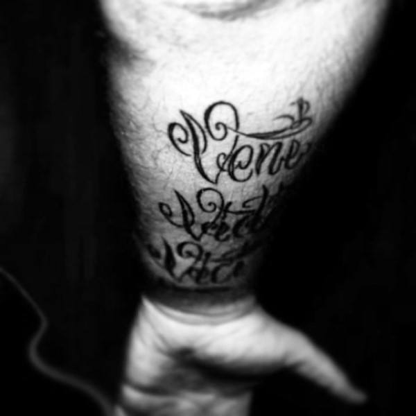 Man With Veni Vidi Vici Wrist Tattoo