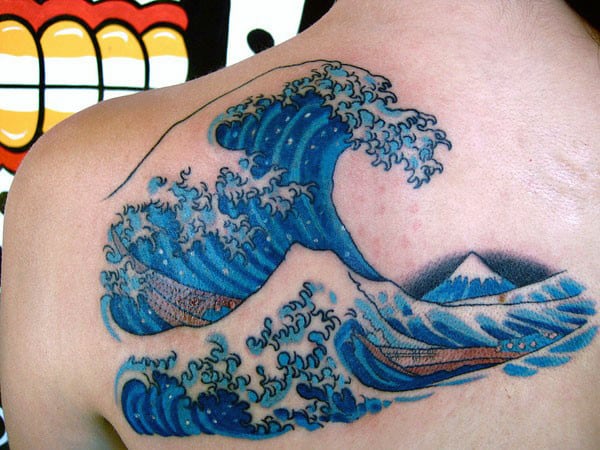 Man With Water Wave Tattoo On Back