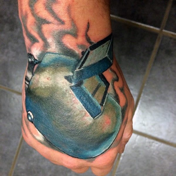 Man With Welding Helmet Tattoo On Hand