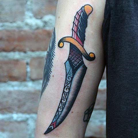 Man With Wonderful Dagger Tattoo On Arms