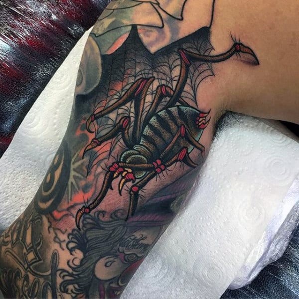 Man Wtih Aztec Patterned Spider Tattoo On Shoulders