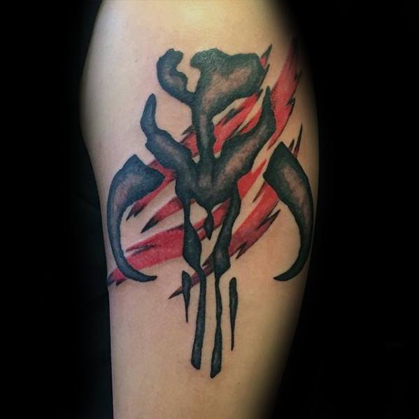 Mythosaur skull tattoo with jagged red slashes in the background, giving a fierce, battle-worn effect on the upper arm.