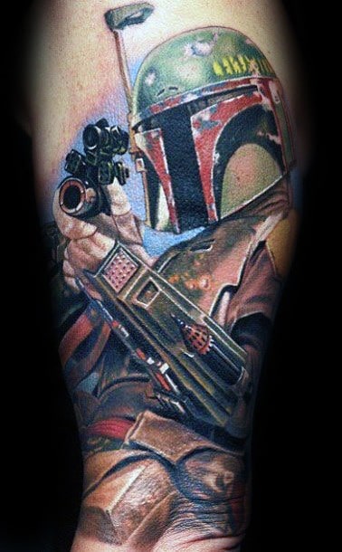 Vivid Boba Fett tattoo in full armor aiming his blaster, showcasing bold colors and dynamic action pose on the forearm.