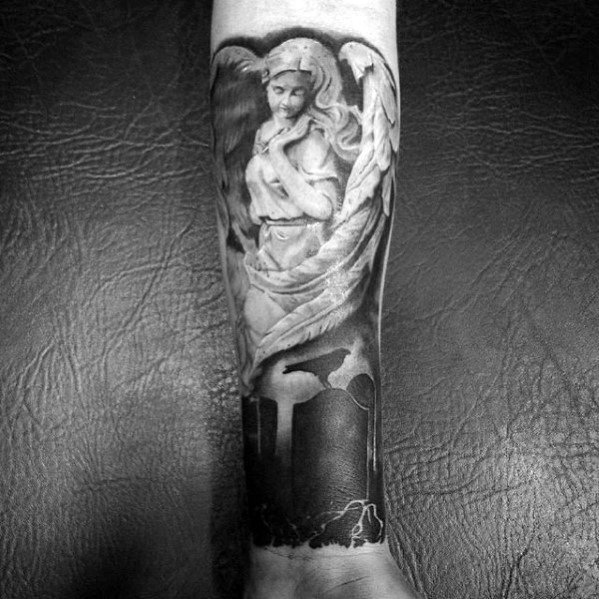 A black and grey tattoo on the forearm featuring an angel in a thoughtful pose, with intricate shading and a dramatic backdrop of a dark cityscape.