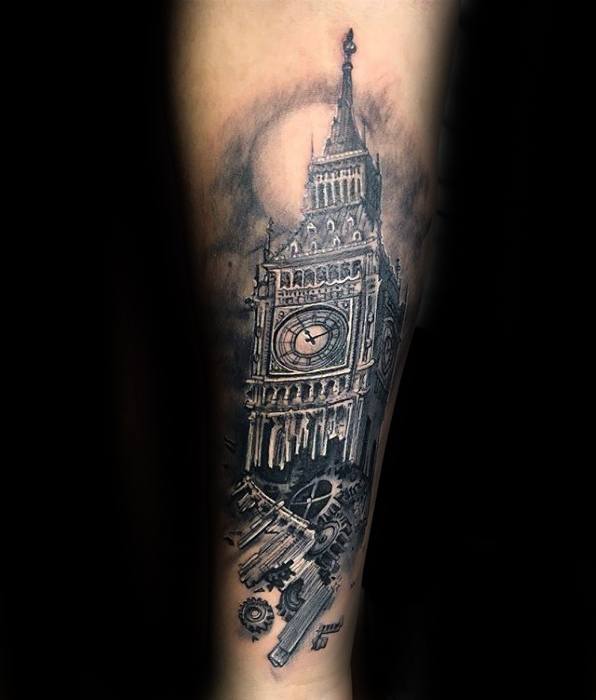 Detailed black and grey tattoo of Big Ben with mechanical gears and clockwork elements, creating a steampunk-inspired design with dramatic shading on the forearm.