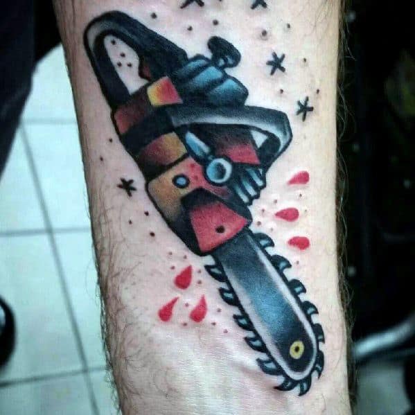 Bold neo-traditional chainsaw tattoo with red and yellow accents, dripping blood, and small starburst details for added visual punch.