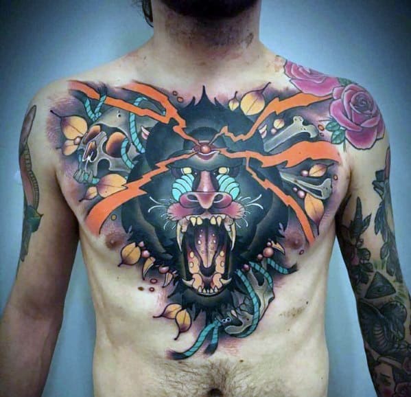 Neo-traditional baboon chest tattoo with bold colors, fierce expression, lightning cracks, and dynamic shading for a powerful and striking design.