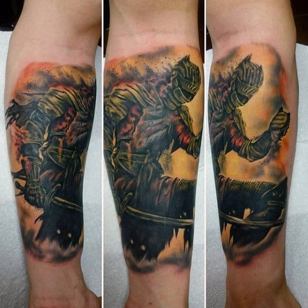 Dynamic Dark Souls tattoo of a warrior in battle-ready pose with fiery tones, detailed armor, and a dark, smoky background.
