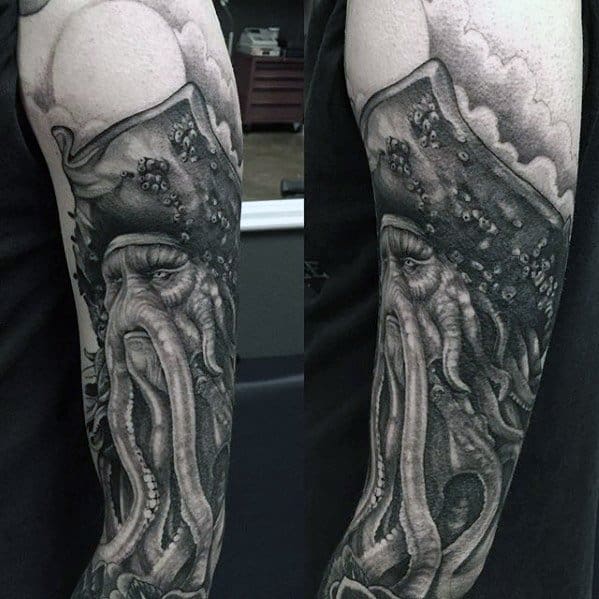 Black and gray pirate-themed arm tattoo featuring Davy Jones and octopus tentacles